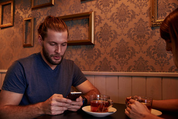 Young couple sitting in a pub