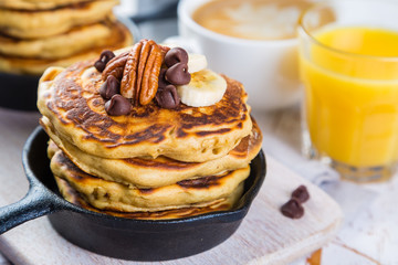 Breakfast - chocolate chip pancakes with coffee and juice