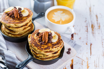 Breakfast - chocolate chip pancakes with coffee and juice
