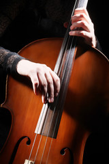 Cello player cellist hands playing violoncello pizzicato