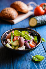 Horiatiki salata - traditional Greek salad made of tomato, cucumber, Feta cheese, Kalamata olives, bell bepper and onion