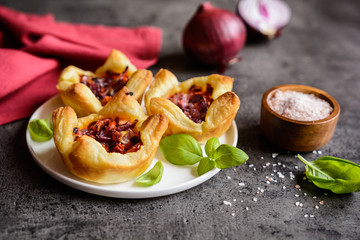 Red onion and sun-dried tomato mini tartlets