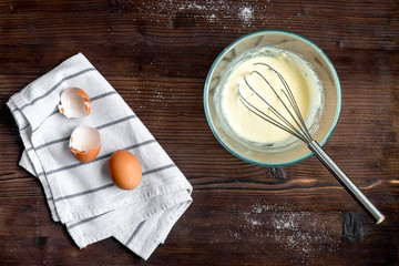 cooking pancake on wooden background top view ingredients for making