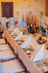 Table setting with food and drink. Restaurant interior