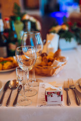 Table setting with food and drink. Restaurant interior