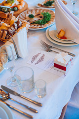 Table setting with food and drink. Restaurant interior