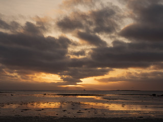 Sunset sky over ocean.