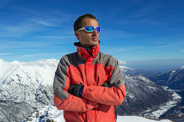 Man with sunglasses looking at the top