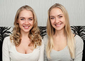 Two young women twins smiling