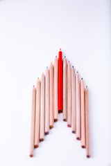 the wooden pencil arrange as head of arrow with one different as a symbol of difference concept