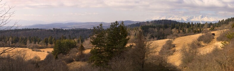 Spring panorama of mountain and church in the middle of forest. Spring panorama of High Tatra and Marian mountain with church. Levoča mountain - Spi&scaron;.