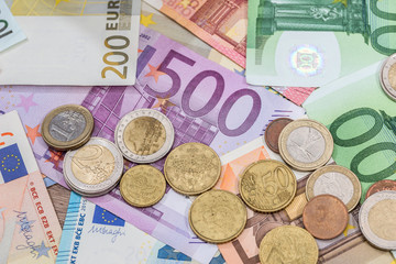 euro banknote and coins as money finance concept.