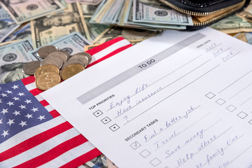 to do list with usa flag, dollar and pen.