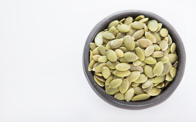 Pumpkin seeds on white background