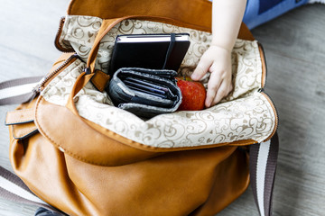 inside woman handbag on the wooden floor