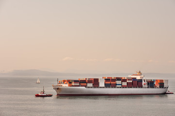 Container ship tugged across Puget Sound to Seattle port
