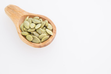 Pumpkin seeds on white background