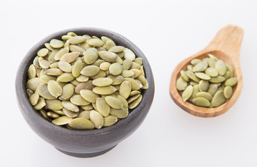 Pumpkin seeds on white background