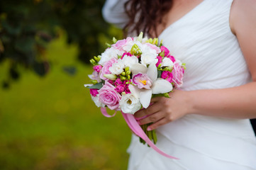Obraz na płótnie Canvas Bride with bouquet, closeup