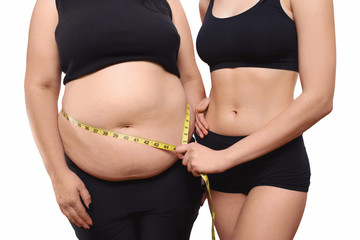 Trainer measures overweight woman