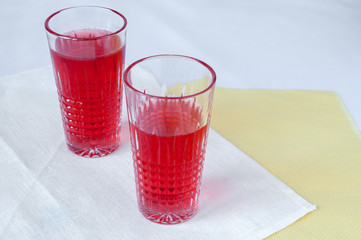 Drink red currant in a beautiful transparent glass