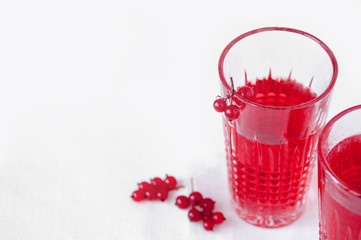 Drink red currant in a beautiful transparent glass