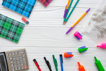 stationery. notebooks, pens, pencils on a white background