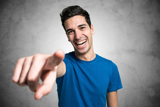 Young man pointing his finger