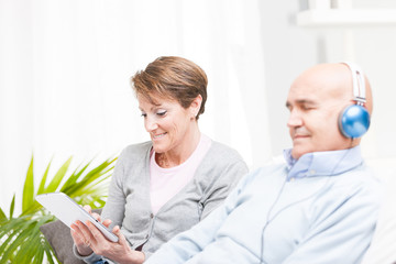 Pretty middle-aged woman using a tablet