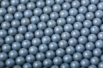 background of gray airsoft balls of 6mm
