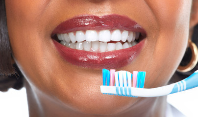 African-American woman with toothbrush.