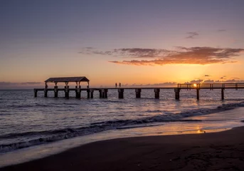 Poster de jardin  Photo of Waimea Town pier at sunset taken with long exposure used to smooth and blur the ocean.  © Jeff Whyte