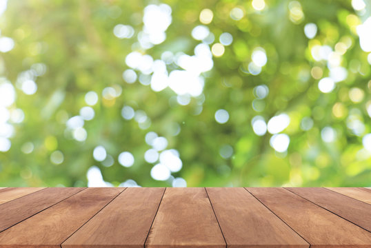 Abstract spring or summer with sunlight background and wood table