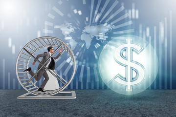 Business concept with businessman running on hamster wheel