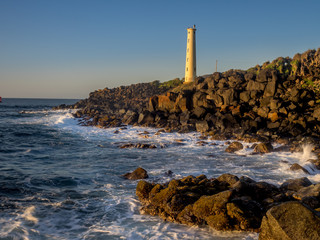 Ninini Point Lighthouse on Nawiliwili Bay in  Kaua'i' Hawai'i overlooking the ocean.