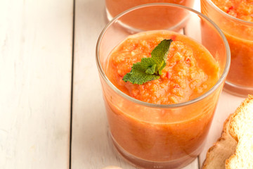 Tomato soup gazpacho, bread closeup.