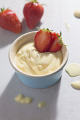 Vanilla custard dessert with fresh strawberries