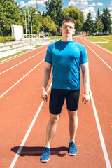 Obraz premium Athletic man posing outdoors.