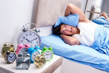 Man having trouble waking up in morning