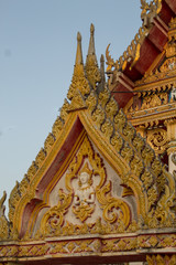 Fototapeta na wymiar Gods or angels stucco sculpture decorate roof of thai temple