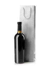 Wine bottle and gift bag on white background