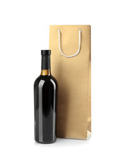 Wine bottle and gift bag on white background