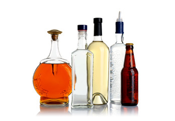 Different bottles of wine and spirits on white background