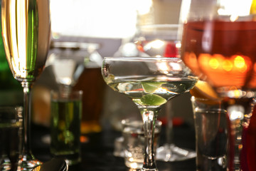 Glasses with different wine and spirits, closeup