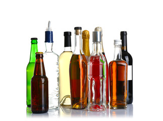 Different bottles of wine and spirits on white background