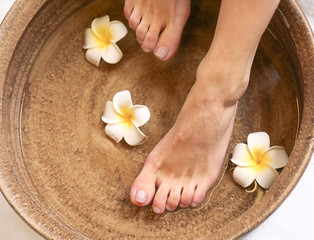 Fototapeta na wymiar Female feet treatment in spa salon