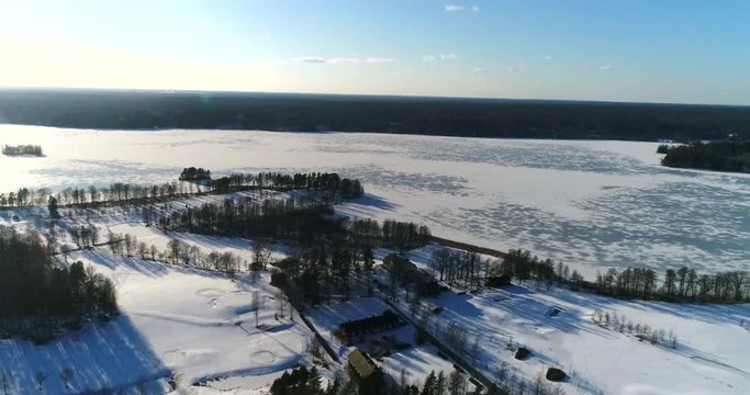 Bodom mansion, Cinema 4k aerial flight above a golf course,and heading towards Bodom mansion, on a sunny and snowy winter day, in Espoo, Finland