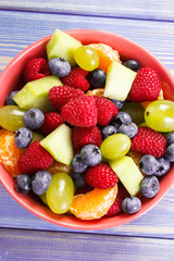 Fresh fruit salad in glass bowl, healthy nutrition concept