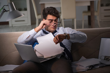Businessman workaholic working late at home