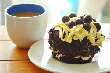 chocolate cake topping vanilla cream and ball with coffee
